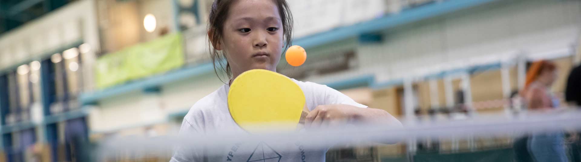 A young girl playing Table Tennis at an insport Series event