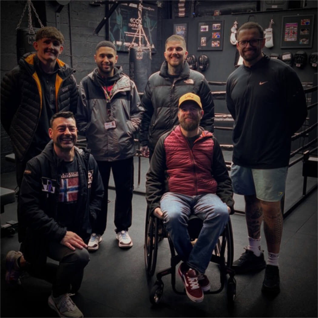 Club leaders pose in the gym with Leif Thobroe, DSW Regional Partnership Senior Officer