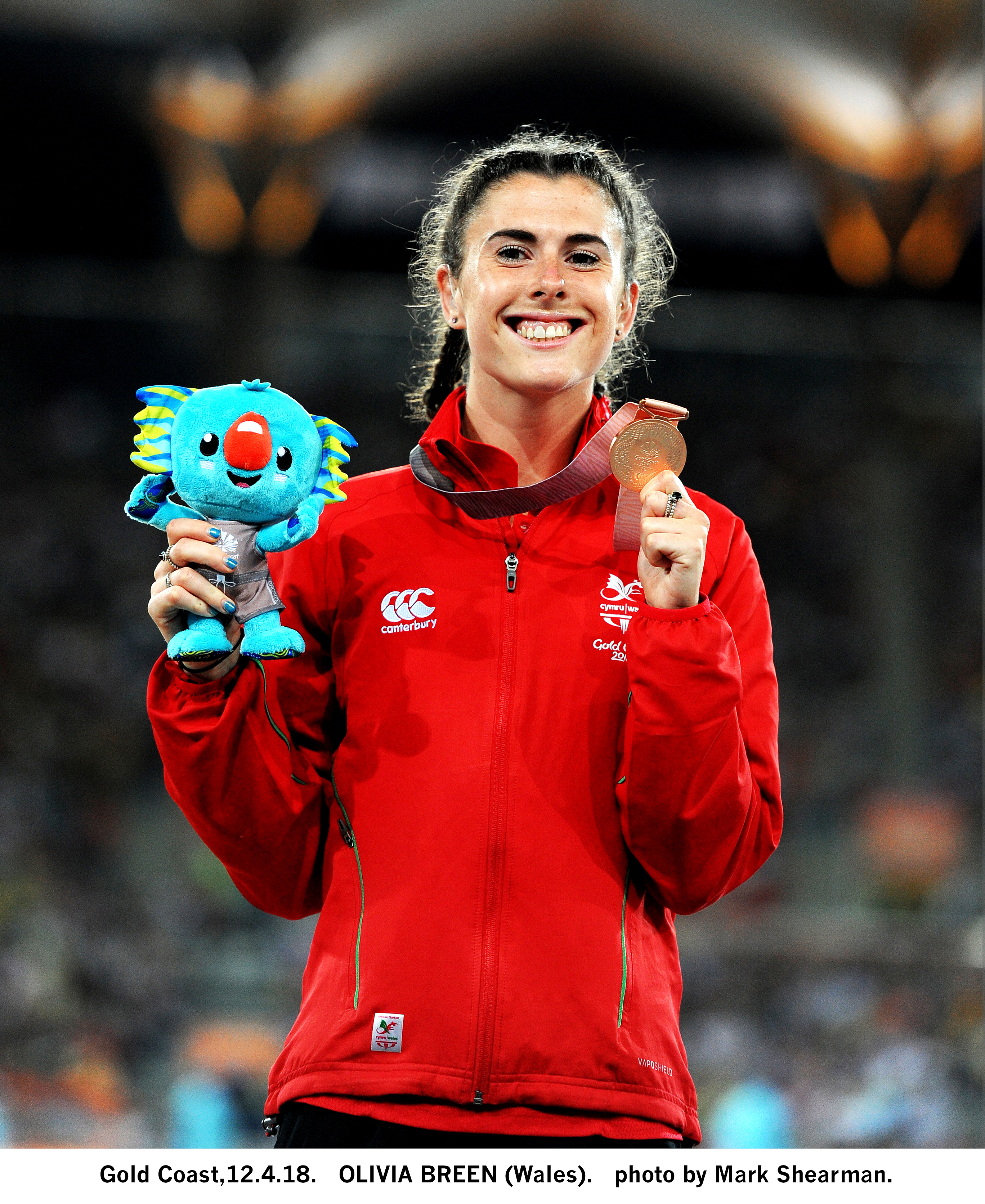 Olivia Breen celebrating winning a medal at the Commonwealth Games 2018