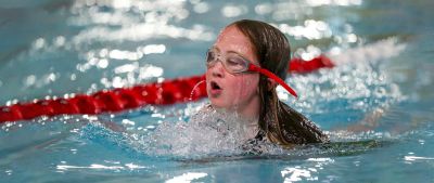A girl with a hidden disability swimming at insport Series: Swim Bike Run