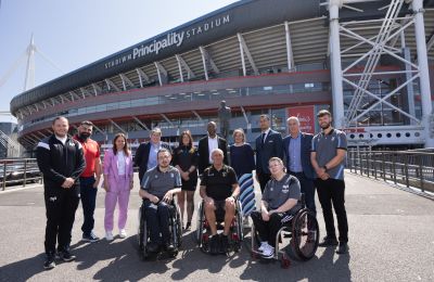 Thirteen people including respresentatives from DSW, WRU and GWBR posing for a photo outside Principality Stadium in Cardiff