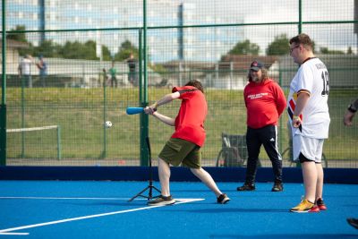 Participants taking part in baseball exercises